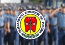 policemen behind the napolcom logo